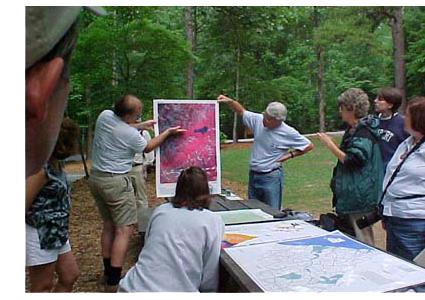 photo of people studying map