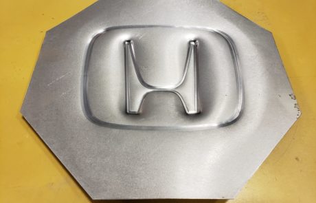 Incrementally formed Honda logo