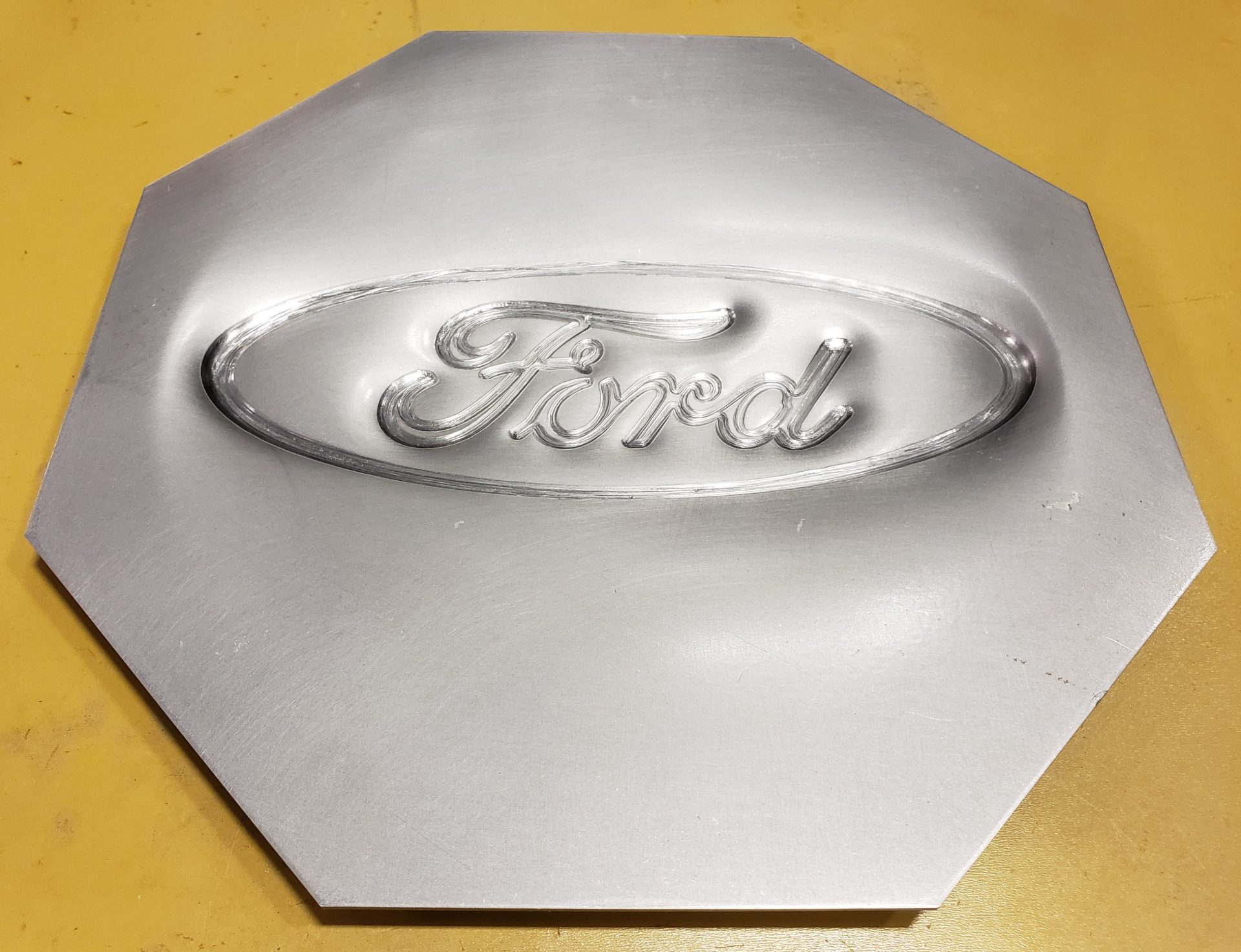 Incrementally formed Ford logo
